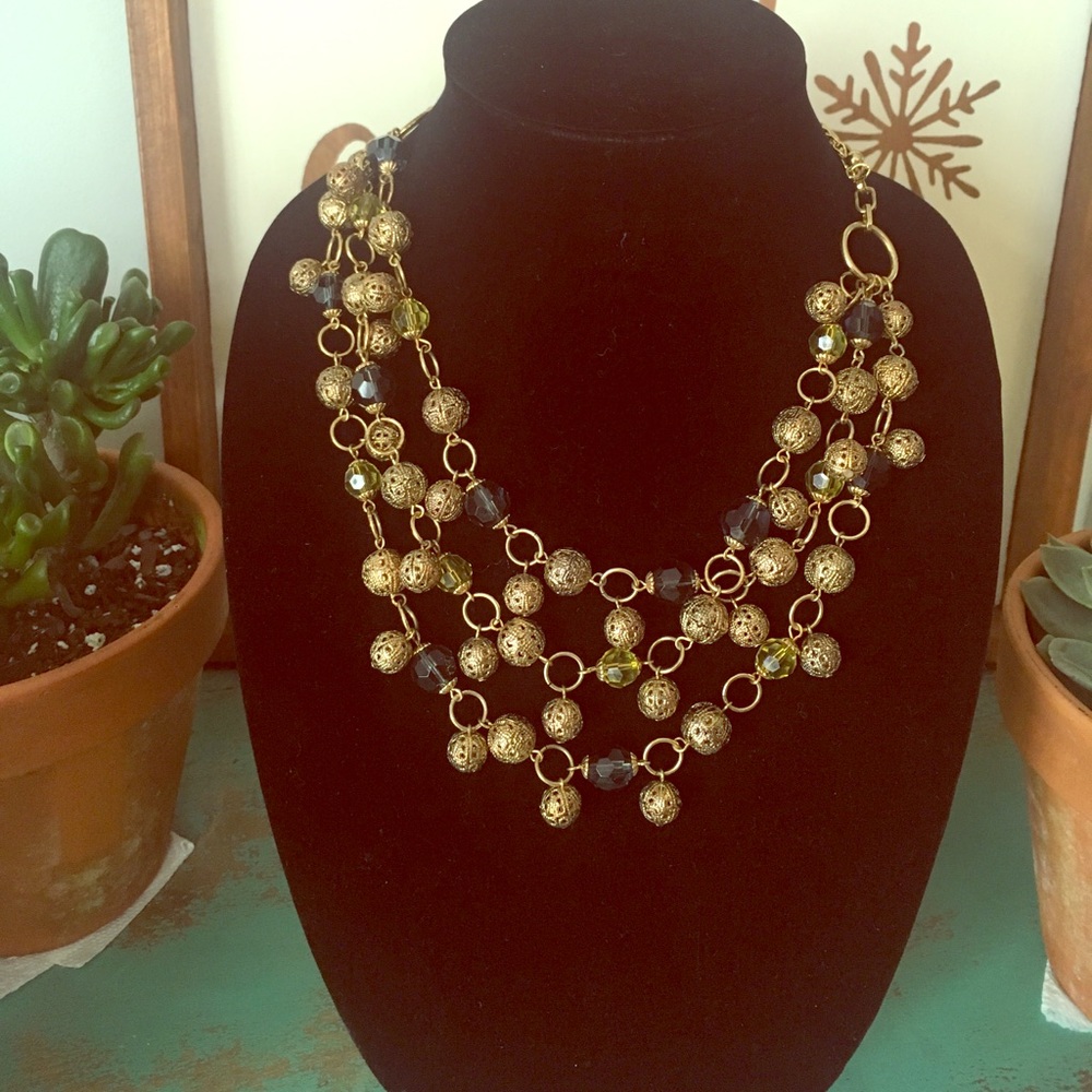 Multi strand metal and blue and green beading